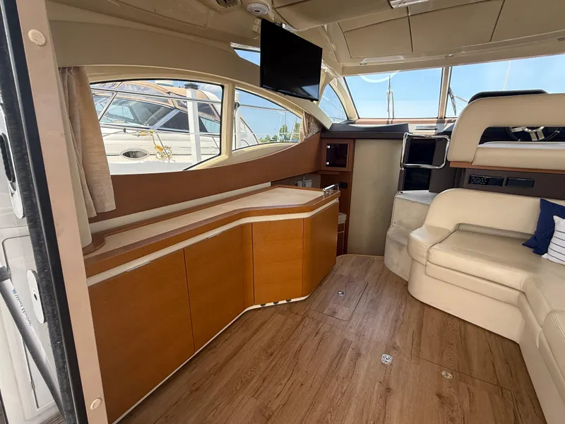 Slide: The Image of Luxurious interior of 2018 Azimut 42 Fly yacht with wood flooring and plush seating. - 8