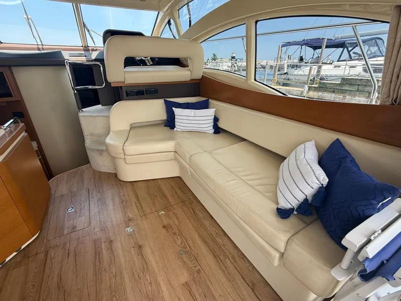 Slide: The Image of Interior of 2018 Azimut 42 Fly yacht with beige seating and blue cushions. - 9