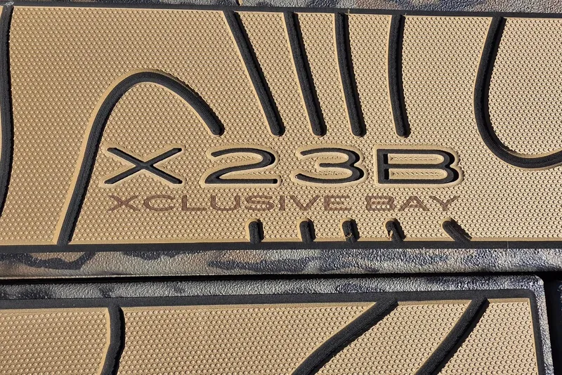 Slide: The Image of Xpress X23B Xclusive Bay boat floor mat design, 2026 model. - 14