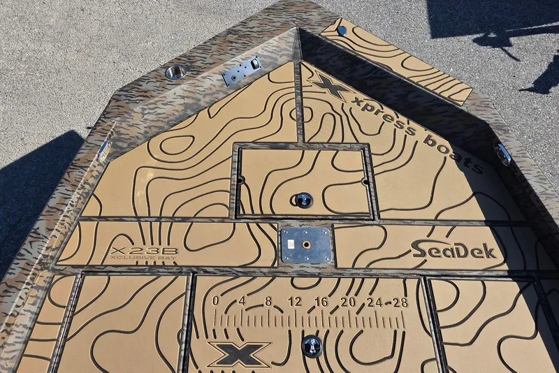 Slide: The Image of 2026 Xpress X23 Bay boat deck with SeaDek padding and topographic design. - 15