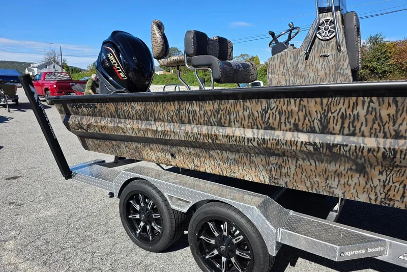 Slide: The Image of 2026 Xpress X23 Bay boat with Yamaha Vmax 250 SHO, camo design, on trailer. - 5