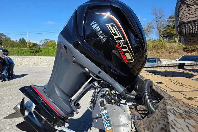 Slide: The Image of 2026 Xpress X23 Bay boat with Yamaha Vmax 250 SHO engine, parked outdoors. - 7