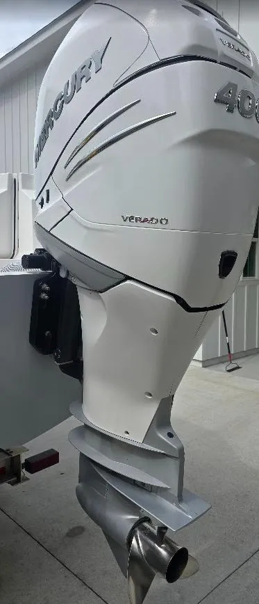 Slide: The Image of Outboard motor on a 2022 Invincible 33 Catamaran, featuring a Mercury 400 Verado engine. - 14