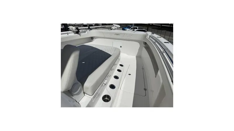 Slide: The Image of 2022 Invincible 33 Catamaran interior with cushioned seating and sleek design. - 9