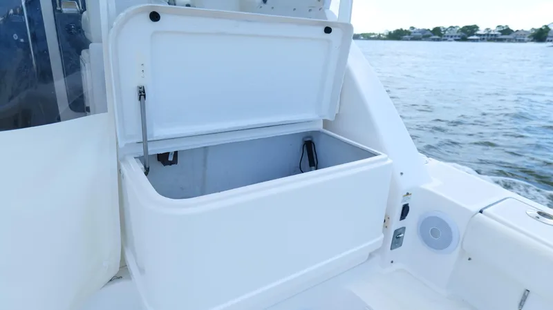 Slide: The Image of Open storage compartment on 2000 Tiara Yachts 3700 Open, with water view. - 15