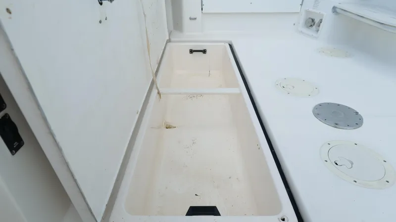 Slide: The Image of Open storage compartment on a 2000 Tiara Yachts 3700 Open boat deck. - 16