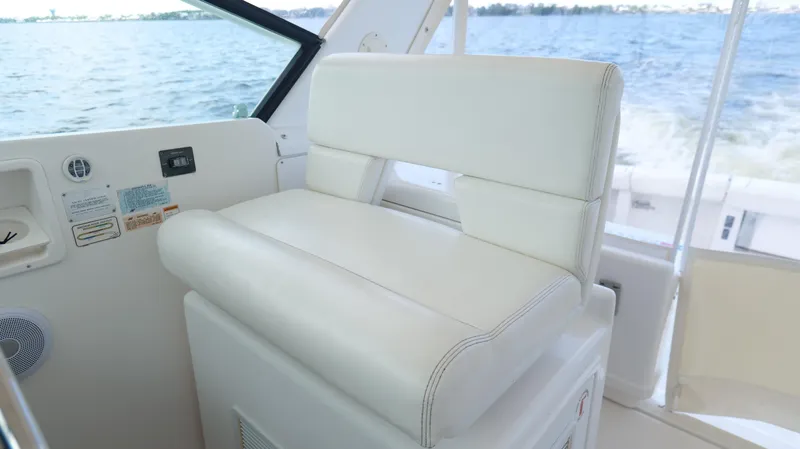 Slide: The Image of White captain's chair on 2000 Tiara Yachts 3700 Open, overlooking water. - 21