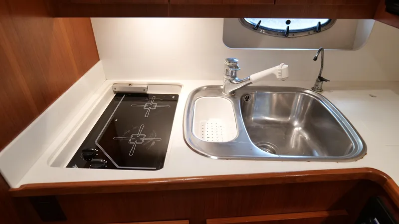 Slide: The Image of Tiara Yachts 3700 Open 2000 model kitchen with stove and sink. - 36