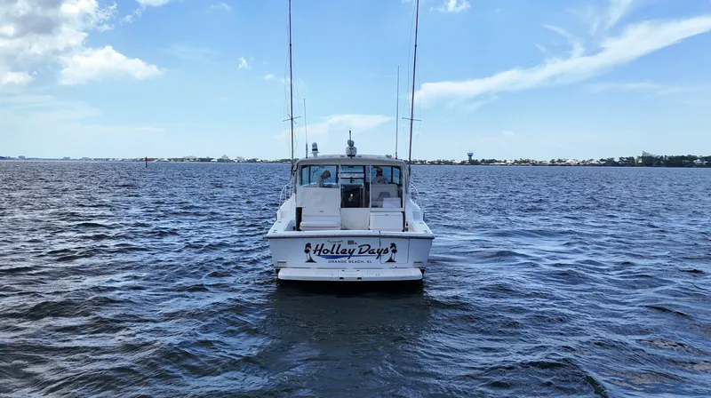 Slide: The Image of 2000 Tiara Yachts 3700 Open on calm water under a clear blue sky. - 4