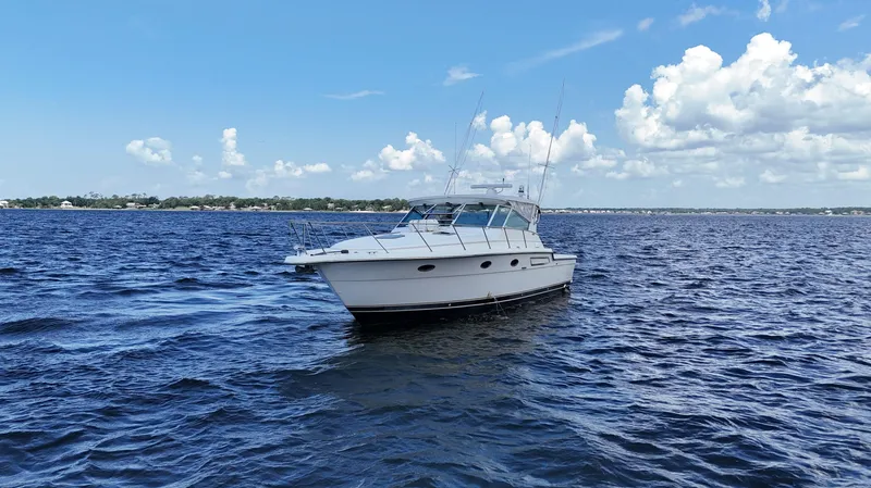 Slide: The Image of 2000 Tiara Yachts 3700 Open cruising on a sunny day with blue skies. - 9