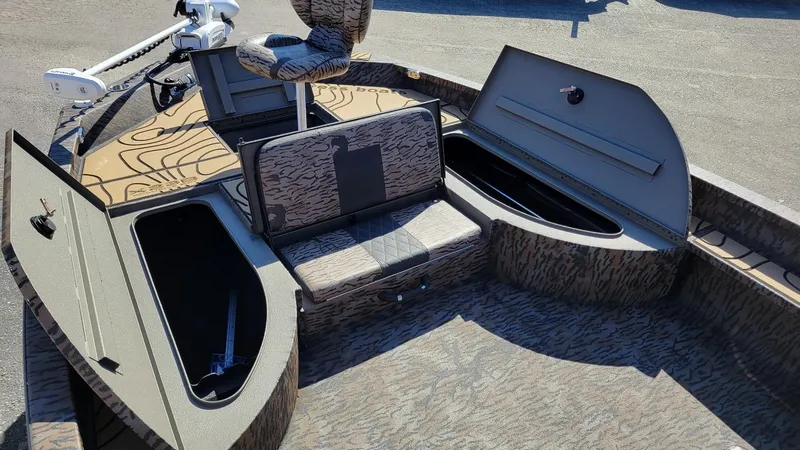 Slide: The Image of 2026 Xpress X23B Bay boat interior with storage compartments and seating. - 10