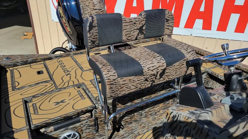 Slide: The Image of Camouflage interior of 2026 Xpress X23B Bay boat with Yamaha Vmax 250 SHO engine. - 15