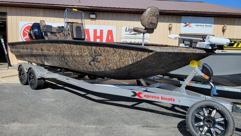 Slide: The Image of 2026 Xpress X23B Bay boat with Yamaha Vmax 250 SHO, camo design on trailer. - 6