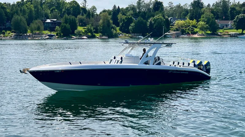 Slide: The Image of 2022 Midnight Express 37 Open boat with luxurious blue and white seating. - 15