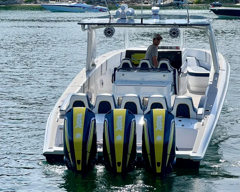 Slide: The Image of Luxurious interior of 2022 Midnight Express 37 Open boat with stylish seating and cup holders. - 16