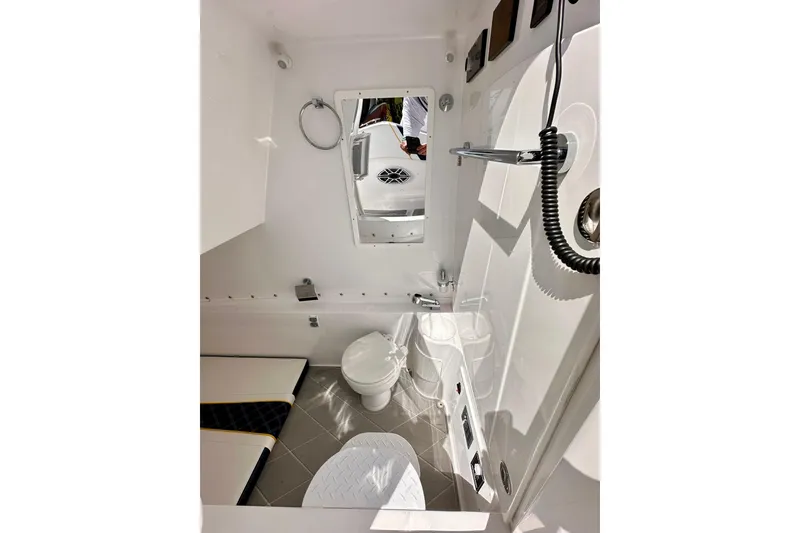 Slide: The Image of Interior of 2022 Midnight Express 37 Open boat bathroom with modern fixtures. - 21