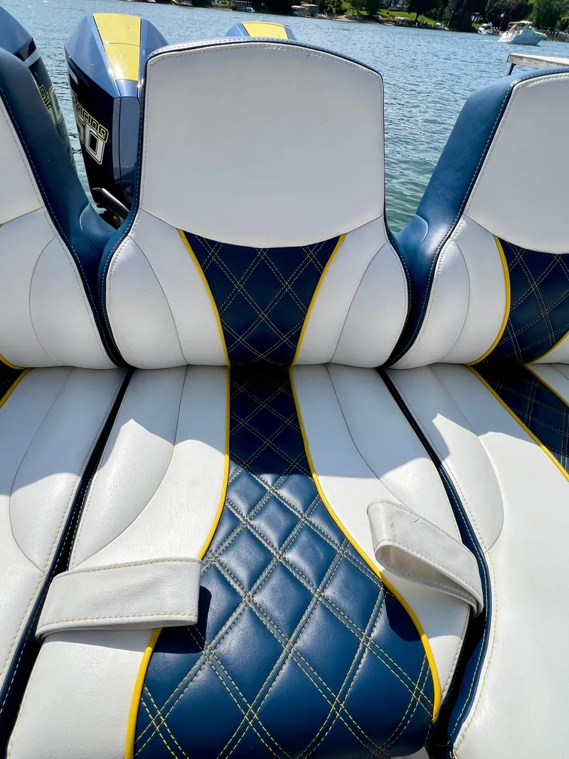 Slide: The Image of 2022 Midnight Express 37 Open boat with triple outboard engines, rear view. - 4