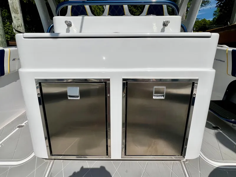 Slide: The Image of 2022 Midnight Express 37 Open boat with powerful outboard engines, parked outdoors. - 5