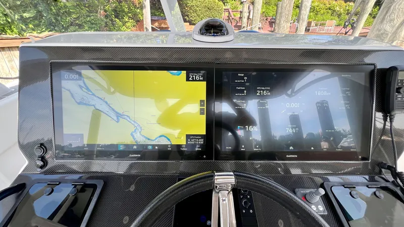 Slide: The Image of 2022 Midnight Express 37 Open boat on trailer under clear blue sky. - 7