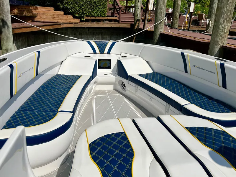 Slide: The Image of 2022 Midnight Express 37 Open boat dashboard with advanced navigation and control systems. - 9