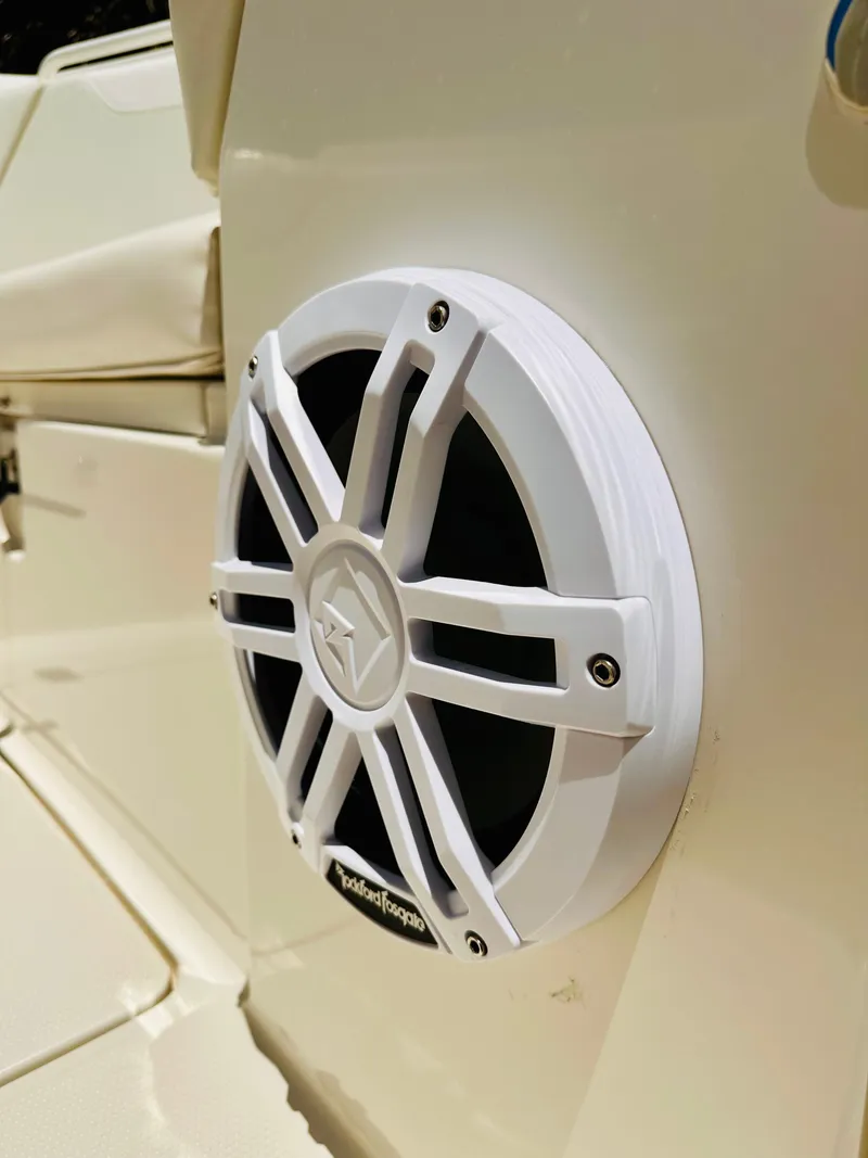 Slide: The Image of Close-up of a white speaker on a 2014 Sailfish 275 DC boat. - 19