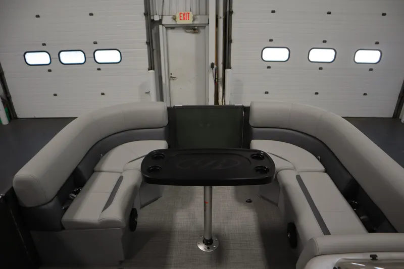 Slide: The Image of 2025 Bentley Pontoons 180 CRUISE LE interior with gray seating and black table. - 10
