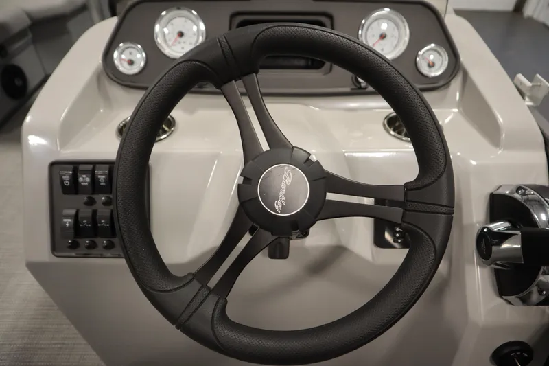 Slide: The Image of 2025 Bentley Pontoons 180 CRUISE LE steering wheel and dashboard controls. - 19