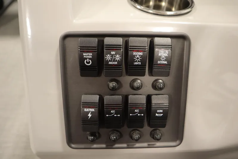 Slide: The Image of Control panel of 2025 Bentley Pontoons 180 CRUISE LE with various switches. - 23