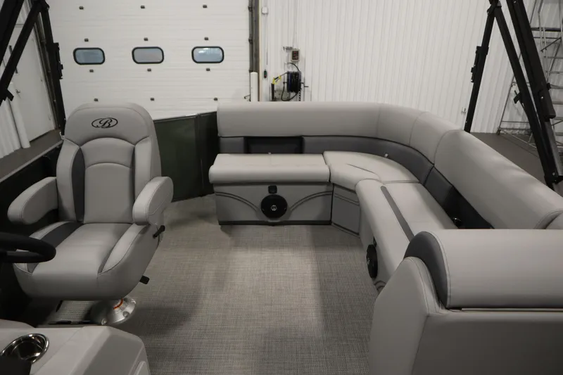 Slide: The Image of 2025 Bentley Pontoons 180 CRUISE LE interior with luxurious gray seating and captain's chair. - 27