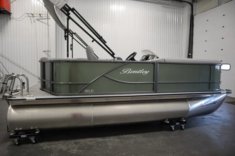 Slide: The Image of 2025 Bentley Pontoons 180 CRUISE LE pontoon boat in a showroom setting. - 3