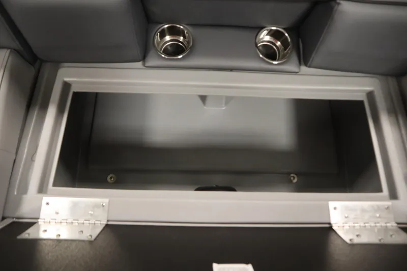 Slide: The Image of 2025 Bentley Pontoons 180 CRUISE LE storage compartment with cup holders and cushioned seating. - 30