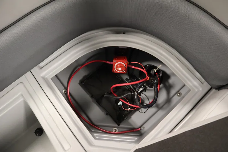 Slide: The Image of Battery compartment of 2025 Bentley Pontoons 180 CRUISE LE with wiring and switch. - 32