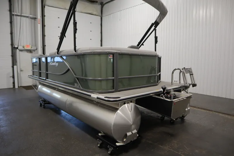 Slide: The Image of 2025 Bentley Pontoons 180 CRUISE LE in a showroom, showcasing sleek design and modern features. - 6