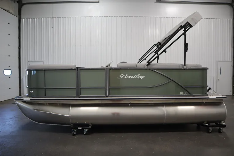 Slide: The Image of 2025 Bentley Pontoons 180 CRUISE LE pontoon boat in a showroom setting. - 7