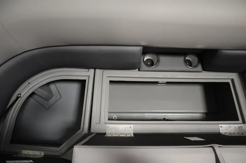 Slide: The Image of 2025 Bentley Pontoons 220 Cruise XL interior storage compartment with cup holders. - 12