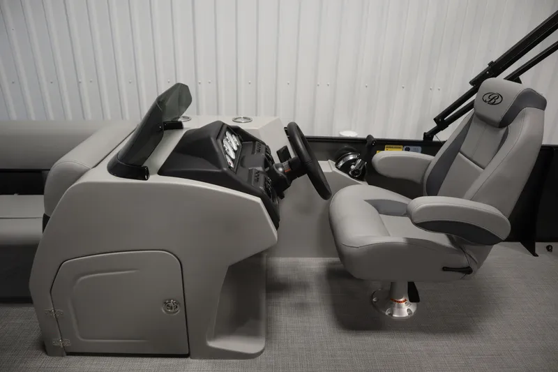Slide: The Image of 2025 Bentley Pontoons 220 Cruise XL interior with steering console and captain's chair. - 14