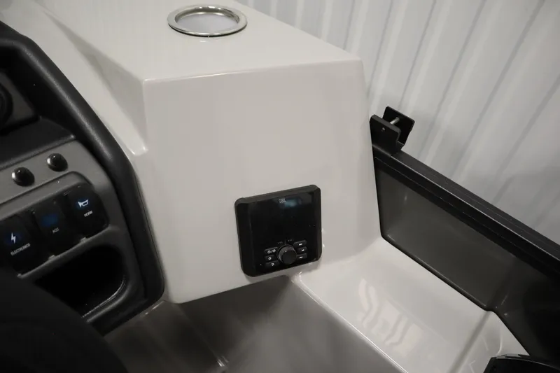 Slide: The Image of 2025 Bentley Pontoons 220 Cruise XL dashboard with control panel and cup holder. - 21