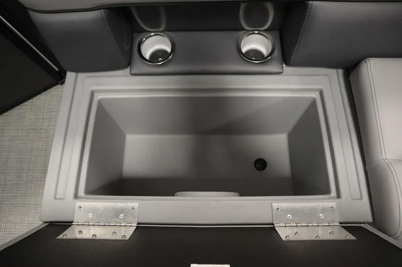 Slide: The Image of 2025 Bentley Pontoons 220 Cruise XL storage compartment with cup holders, interior view. - 27