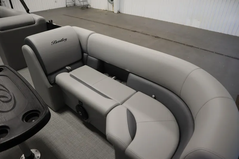 Slide: The Image of 2025 Bentley Pontoons 220 Cruise XL interior with luxurious gray seating. - 8