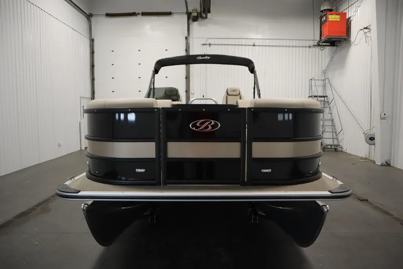Slide: The Image of 2026 Bentley Pontoons 220 Navigator in a showroom, front view. - 1