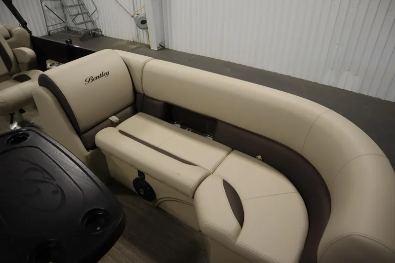 Slide: The Image of 2026 Bentley Pontoons 220 Navigator interior with beige and brown seating. - 11