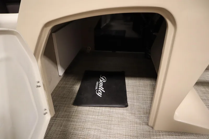 Slide: The Image of Interior view of 2026 Bentley Pontoons 220 Navigator with branded mat on carpeted floor. - 18