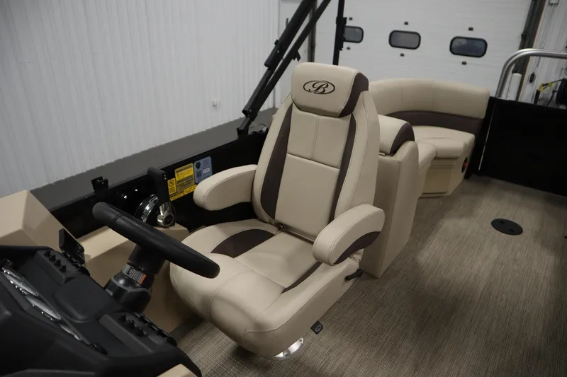 Slide: The Image of 2026 Bentley Pontoons 220 Navigator interior with luxurious captain's chair and steering console. - 26