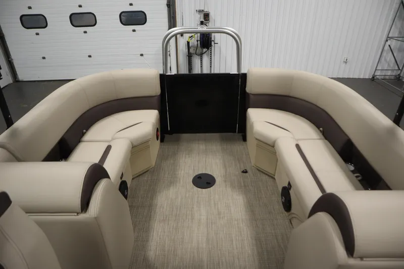 Slide: The Image of 2026 Bentley Pontoons 220 Navigator interior with beige seating and spacious layout. - 28