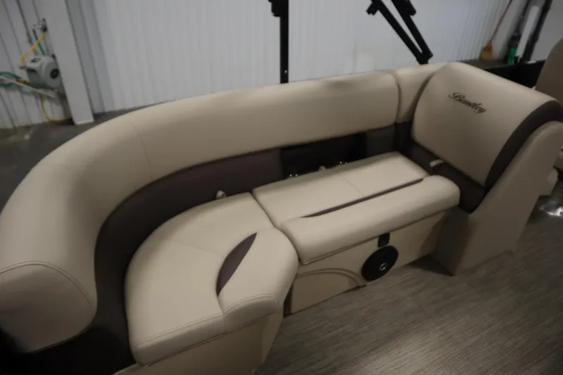 Slide: The Image of 2026 Bentley Pontoons 220 Navigator interior seating, featuring beige and brown upholstery. - 29