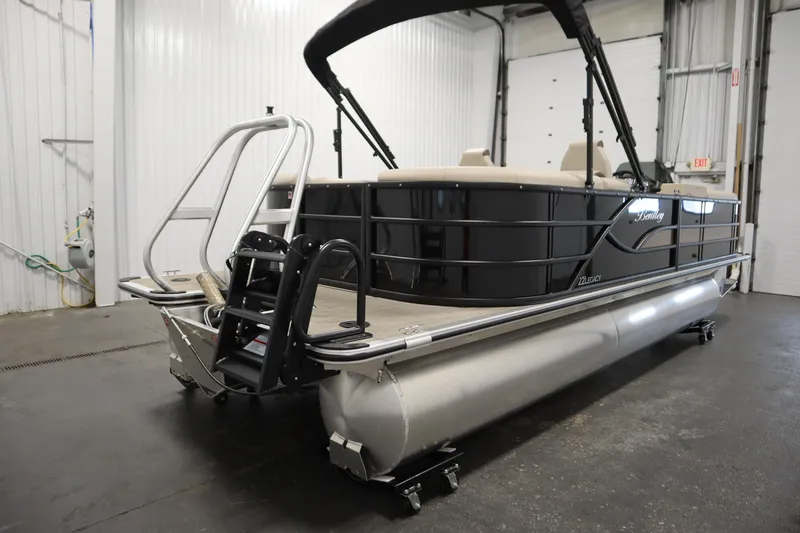 Slide: The Image of 2026 Bentley Pontoons 220 Navigator in a showroom, showcasing sleek design and modern features. - 4