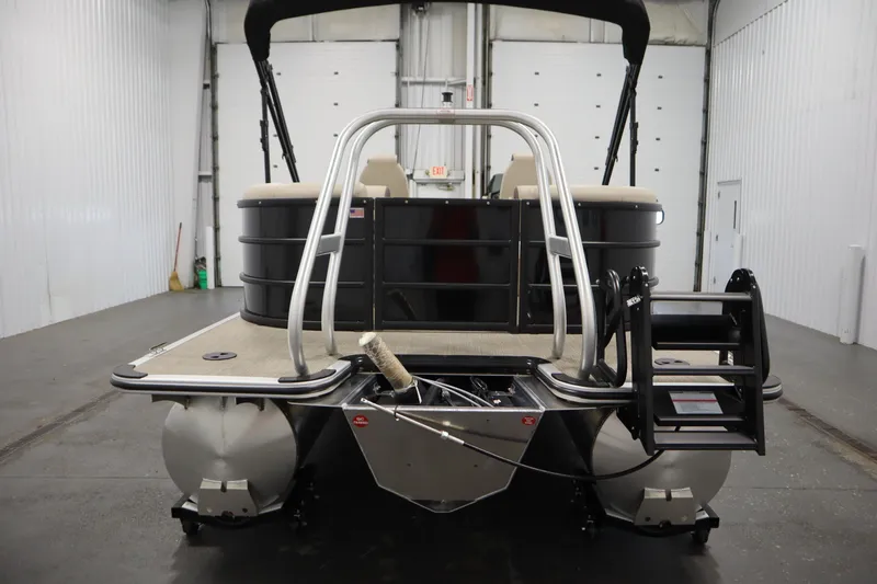 Slide: The Image of 2026 Bentley Pontoons 220 Navigator in a spacious indoor showroom. - 5