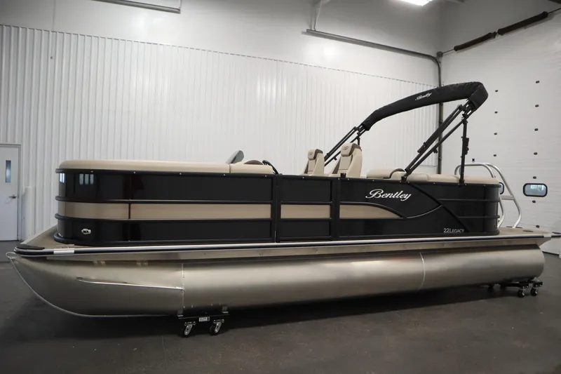 Slide: The Image of 2026 Bentley Pontoons 220 Navigator in showroom, featuring sleek design and modern amenities. - 7