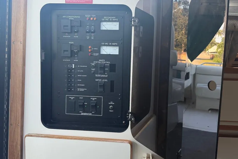 Slide: The Image of Electrical control panel on a 1993 Sea Ray 370 Sundancer boat interior. - 10