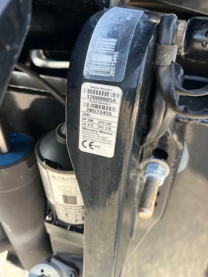 Slide: The Image of Close-up of a Mercury Marine engine label on a 2019 Regency 230 LE3 boat. - 21